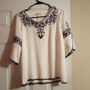 White and navy blue top